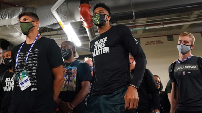 The Milwaukee Bucks hold a meeting after protesting playoff game against the Orlando Magic after Jacob Blake shooting.